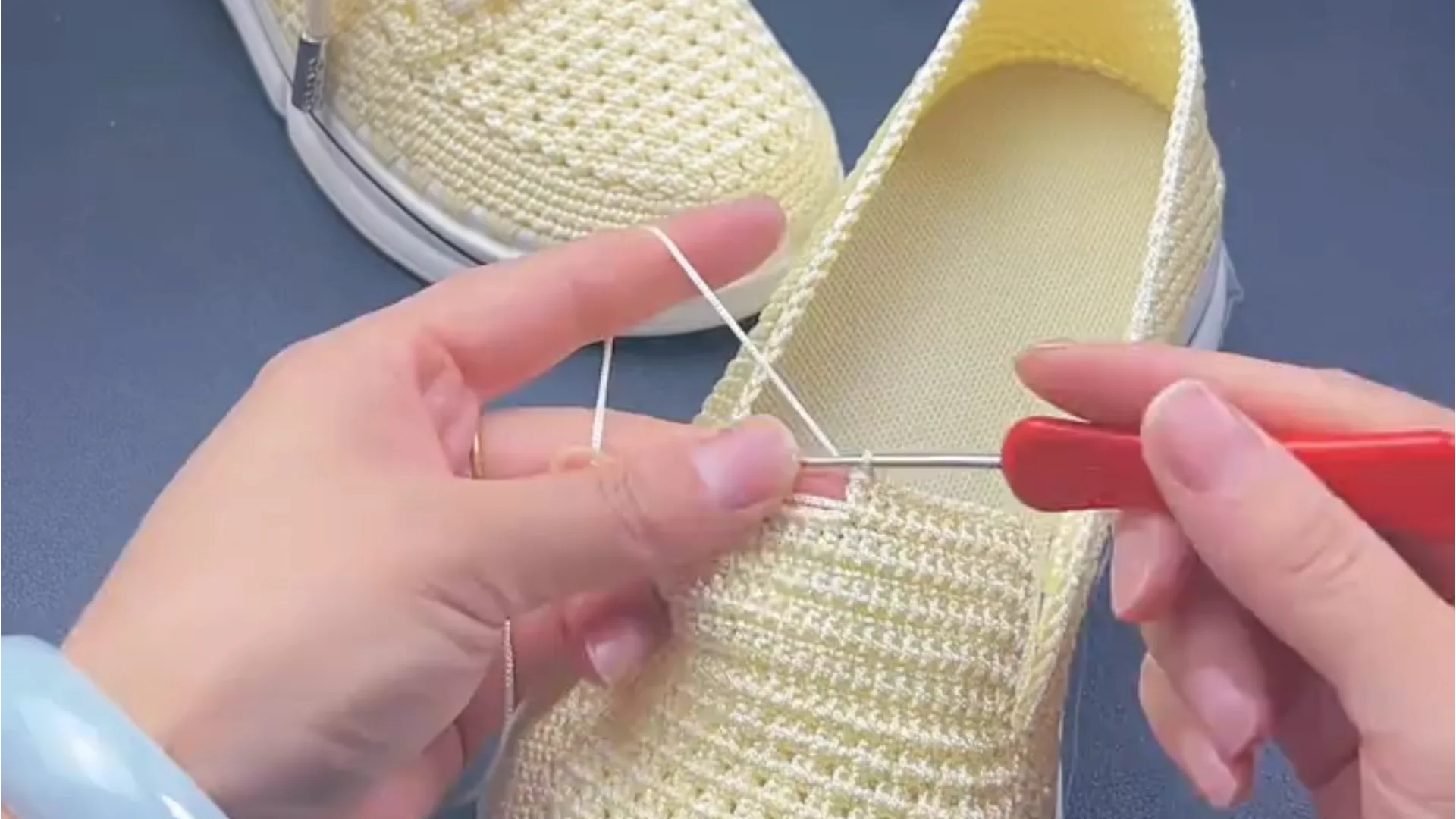 Artisan hands crocheting a handmade knit sneaker stitch by stitch — Xiaorong Handmade
