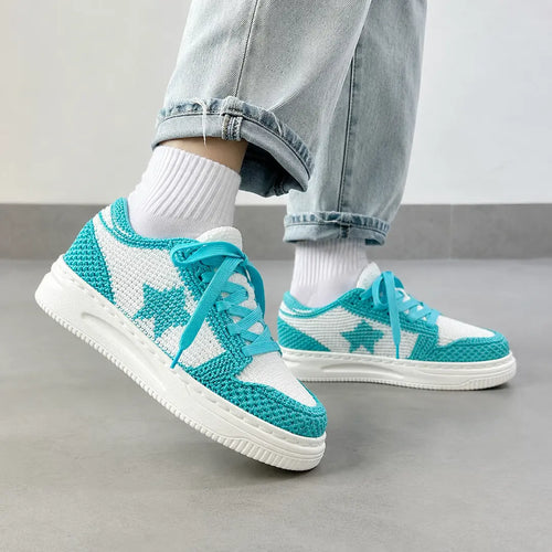 Tiffany Blue handmade crochet sneakers worn on feet with striped socks
